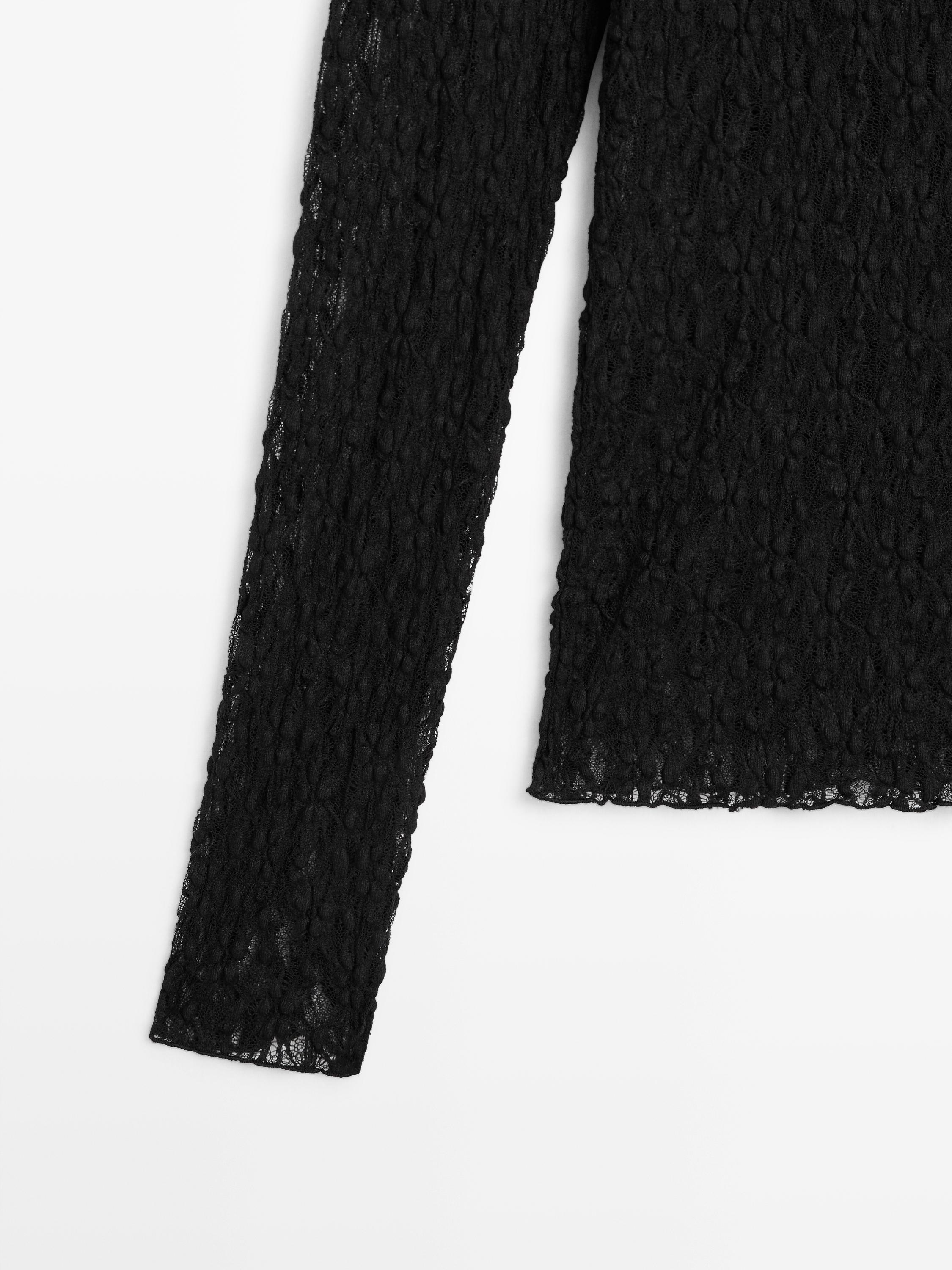 Openwork knit top with long sleeves and lace